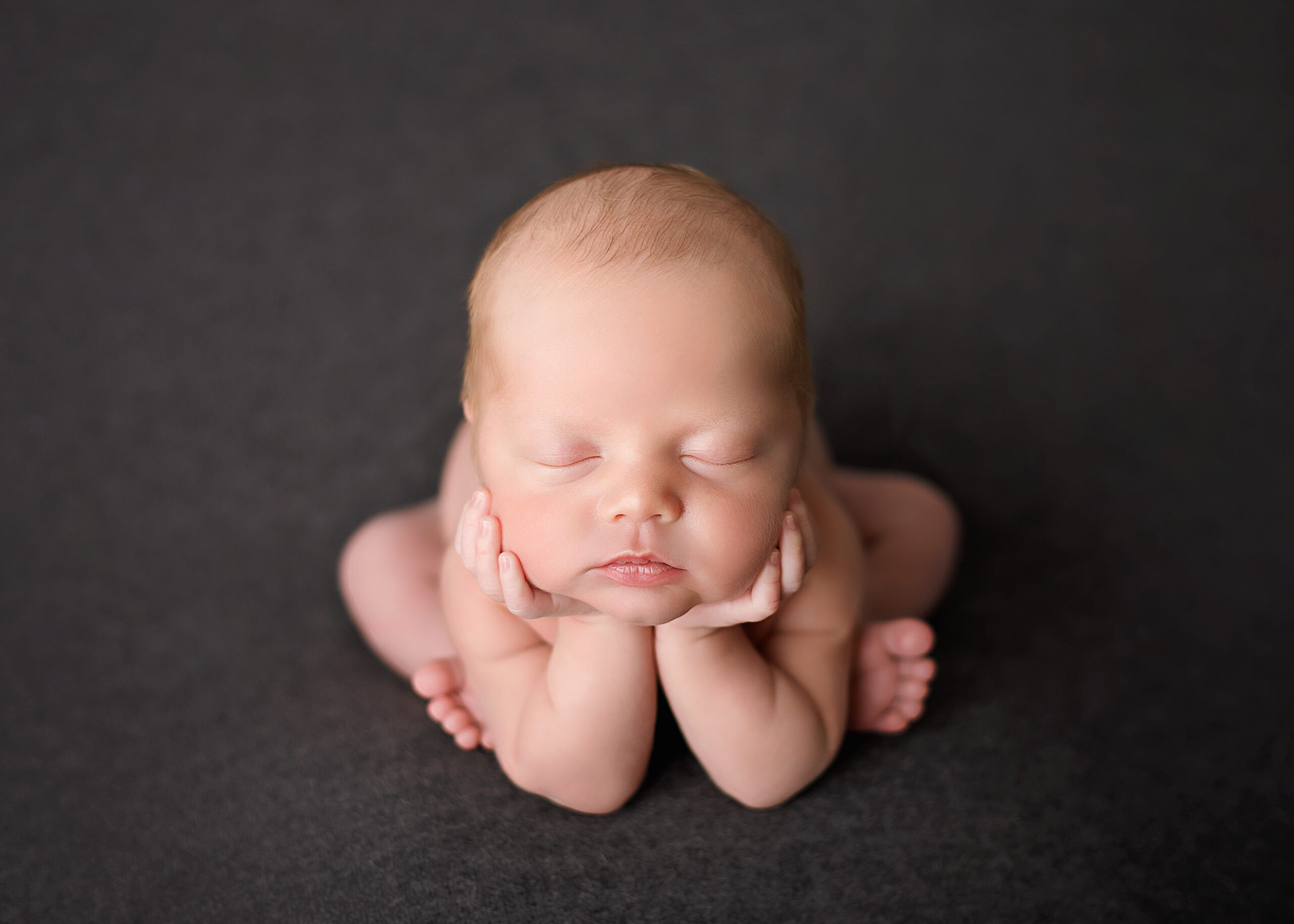 newborn baby posed for a photoshoot Choosing the Perfect Time for Newborn Photos
